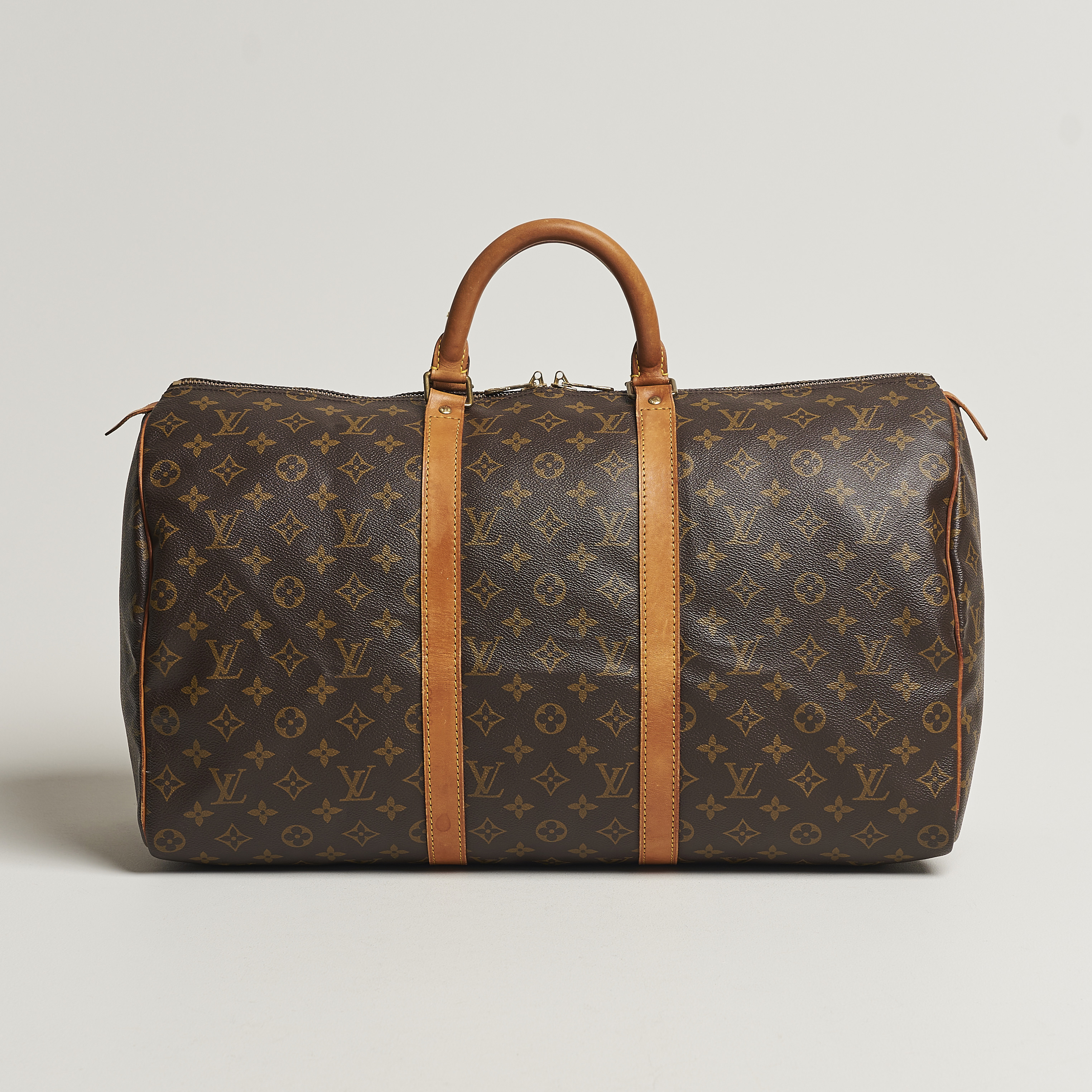 The hand bag silver Louis Vuitton worn by Drake on his account