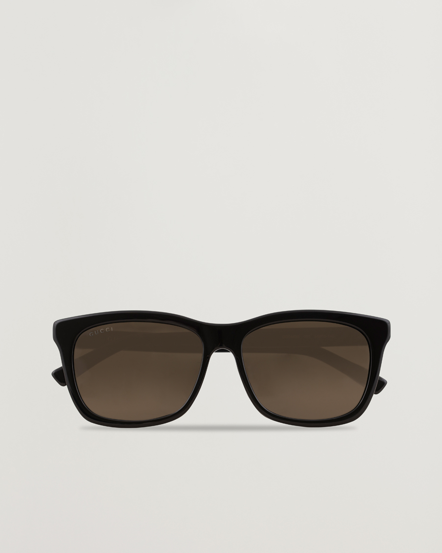 Gucci GG0449S Sunglasses Black/Gold/Brown at CareOfCarl.com
