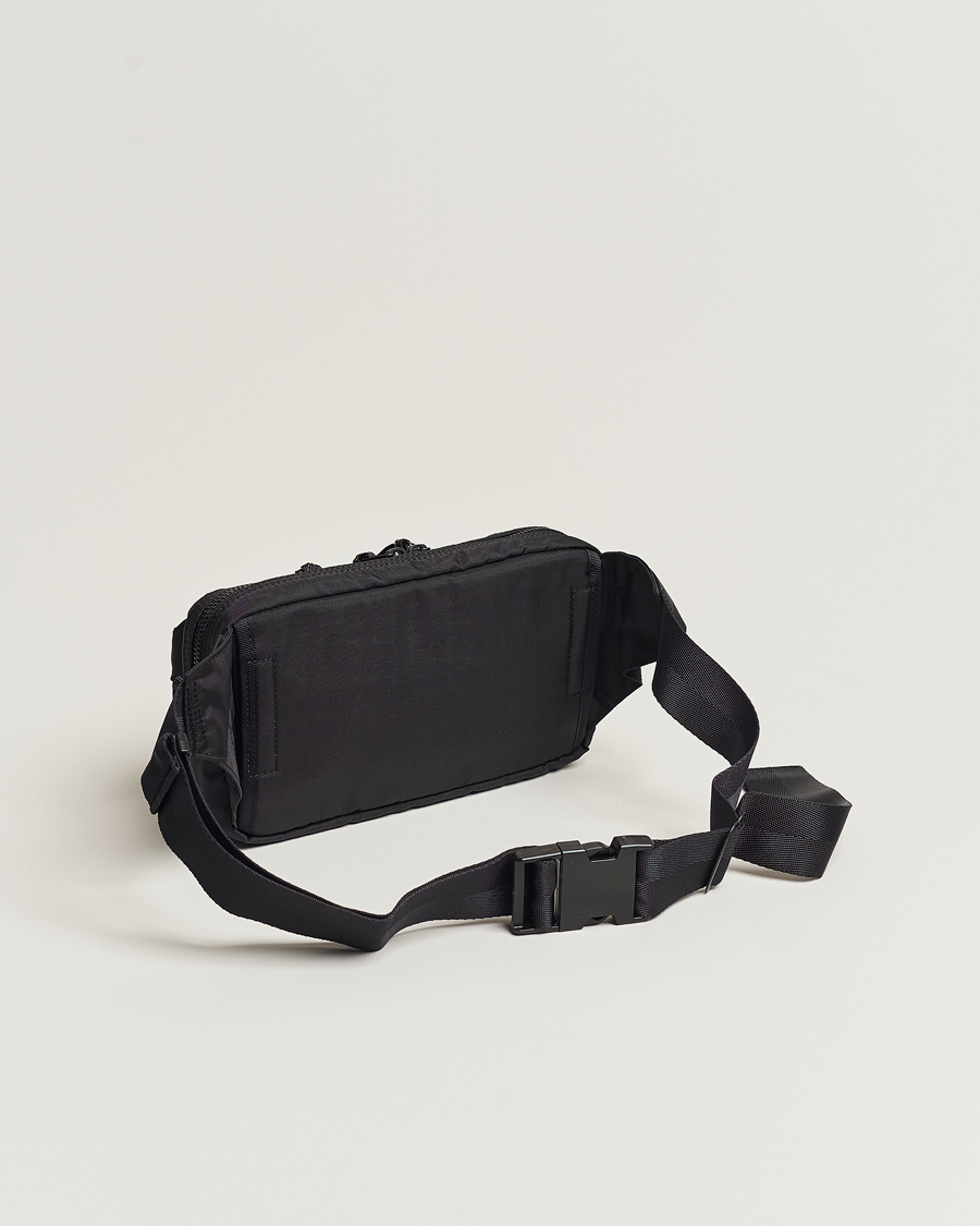 Journey belt bag in black nylon with contrasting white decorations