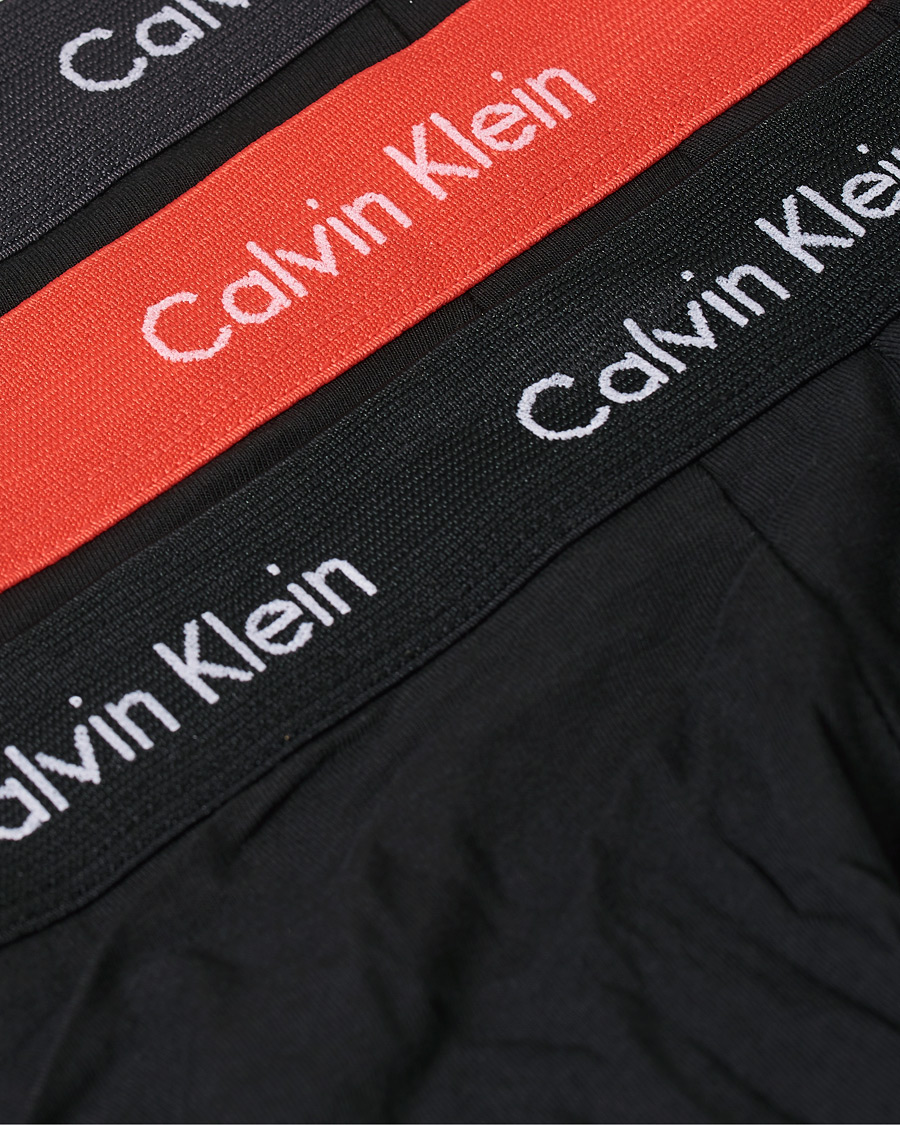 Men | Underwear & Socks | Calvin Klein | Cotton Stretch 3-Pack Low Rise Trunk Black/Coral/Grey