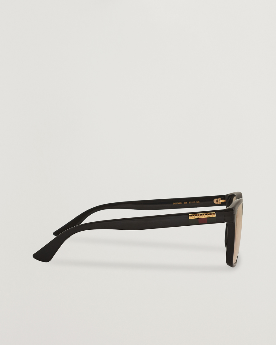Gucci GG0746S Photochromic Sunglasses Shiny Black at CareOfCarl.com