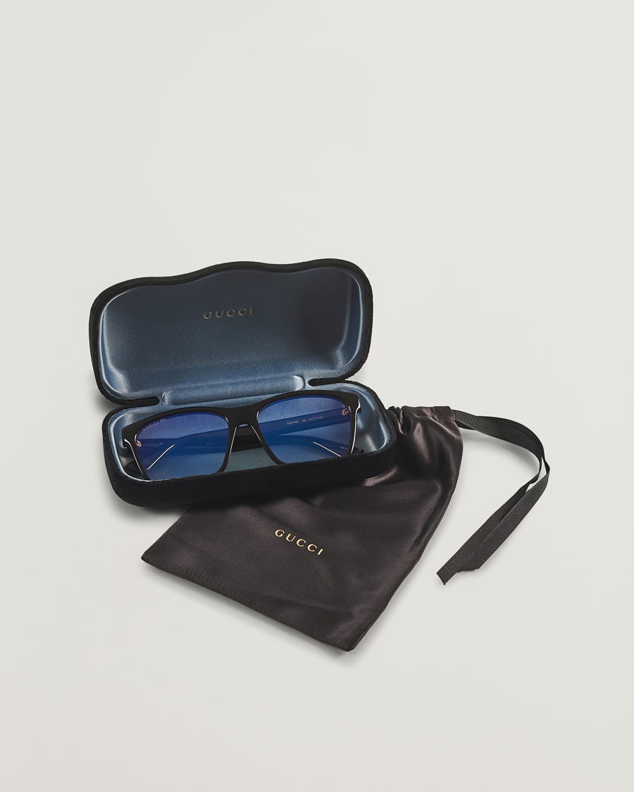 Gucci GG0746S Photochromic Sunglasses Shiny Black at CareOfCarl.com