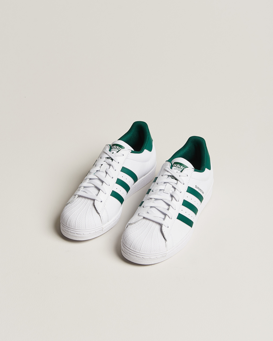 adidas Originals Superstar Sneaker White/Green at CareOfCarl.com adidas Originals Superstar Sneaker White/Green at CareOfCarl.com