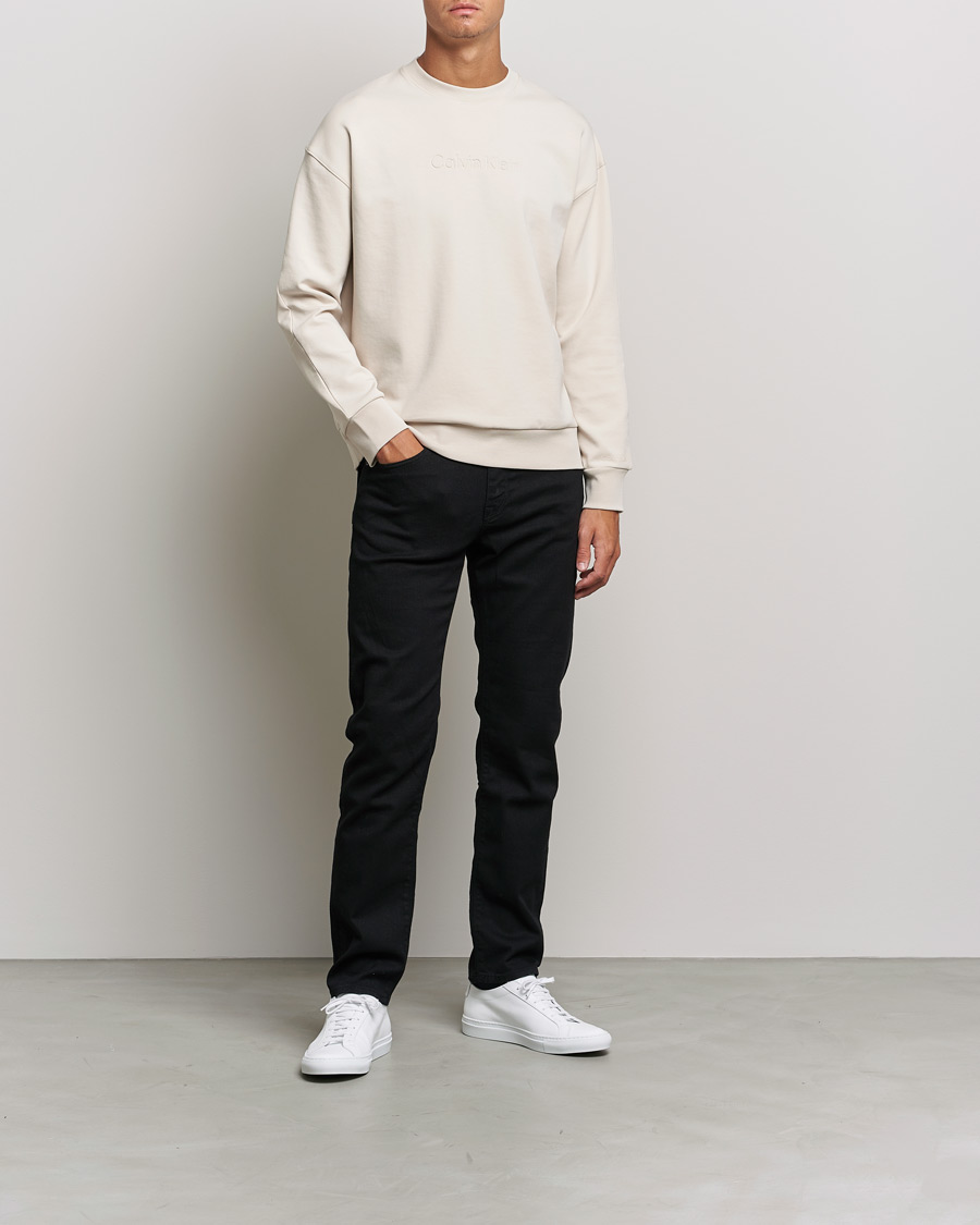 Men | Sweaters & Knitwear | Calvin Klein | Debossed Logo Crew Neck Sweatshirt Stony Beige