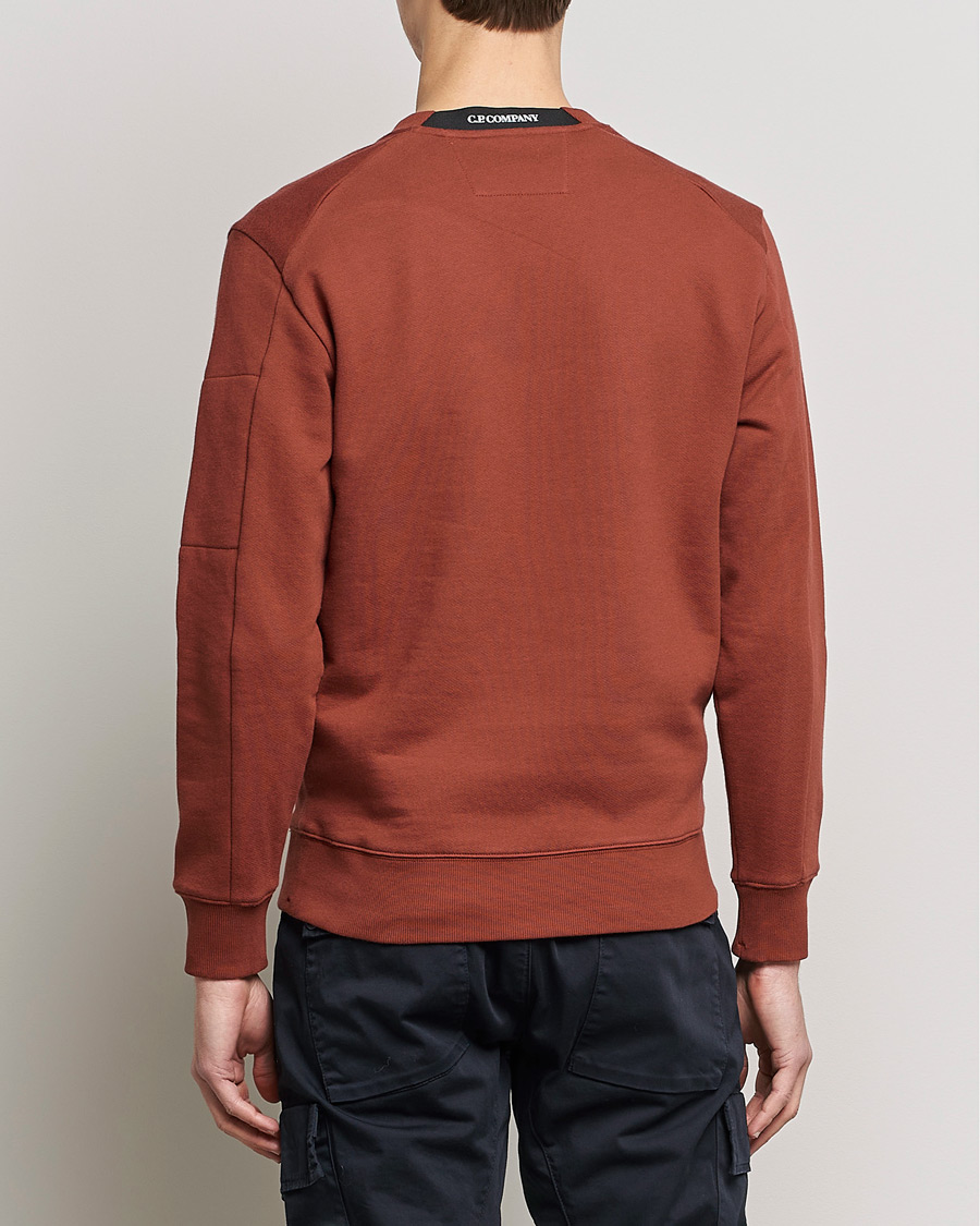 Men | Sweaters & Knitwear | C.P. Company | Diagonal Raised Fleece Lens Sweatshirt Rust