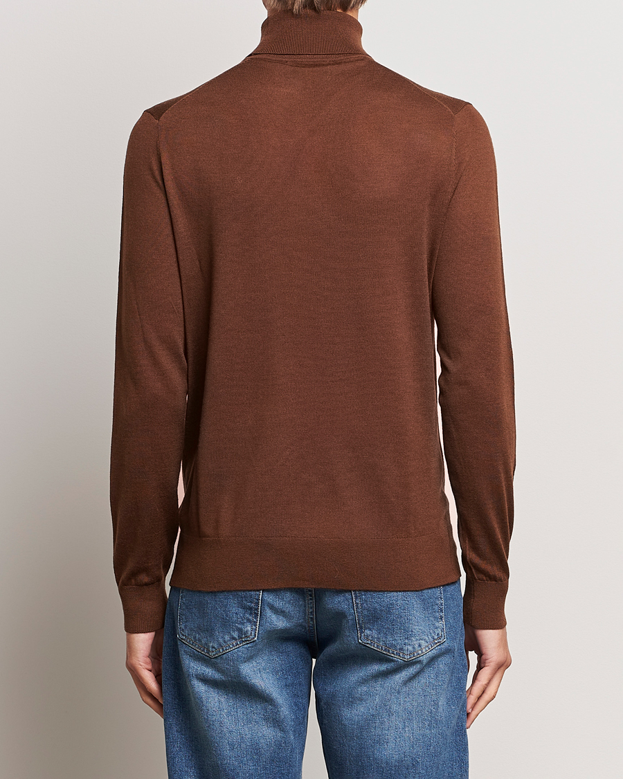 Men | Sweaters & Knitwear | Tiger of Sweden | Nevile Extra Fine Merino Polo Golden Copper