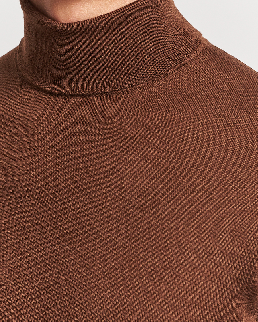 Men | Sweaters & Knitwear | Tiger of Sweden | Nevile Extra Fine Merino Polo Golden Copper