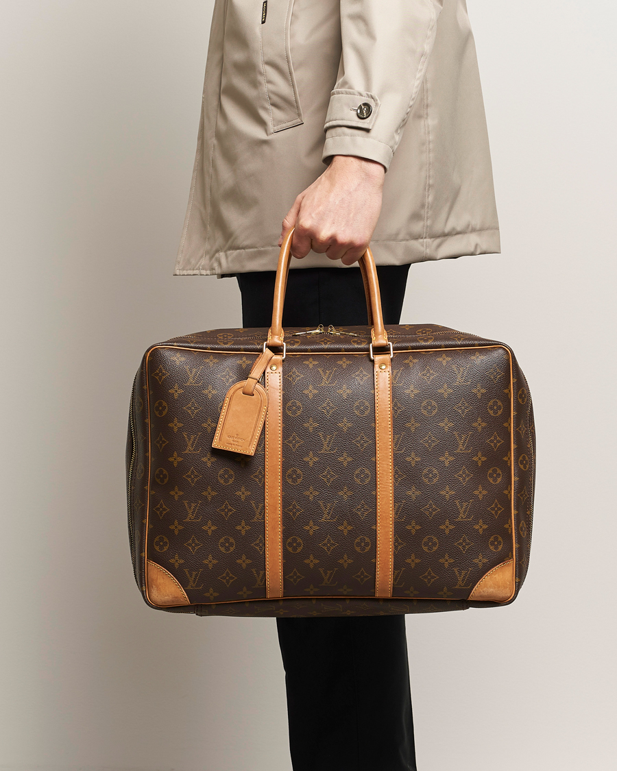 Men | Pre-owned Accessories | Louis Vuitton Pre-Owned | Stratos Cloth bag Monogram 