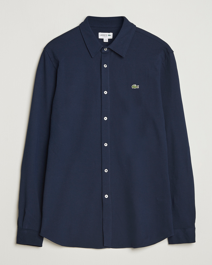 Lacoste Slim Fit Cotton Piqu Shirt Navy at CareOfCarl.com Lacoste Slim Fit Cotton Piqu Shirt Navy at CareOfCarl.com