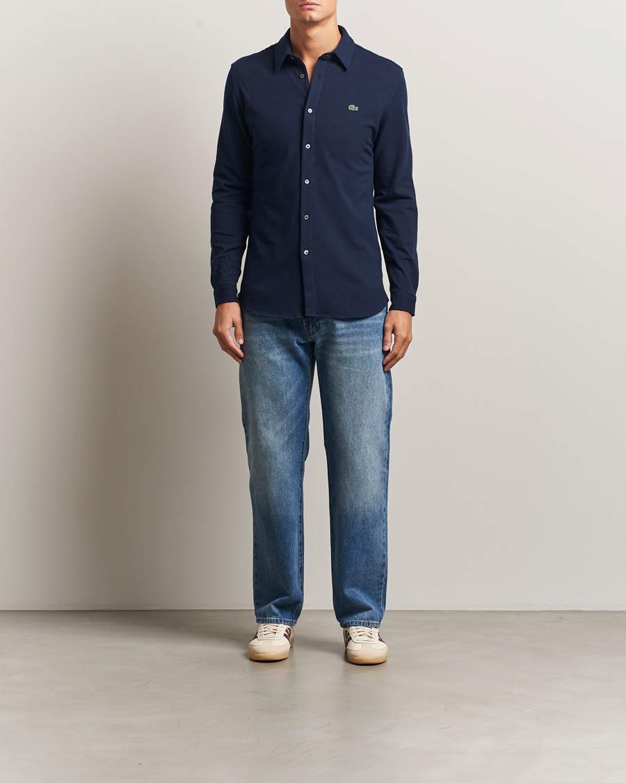 Lacoste Slim Fit Cotton Piqu Shirt Navy at CareOfCarl.com Lacoste Slim Fit Cotton Piqu Shirt Navy at CareOfCarl.com