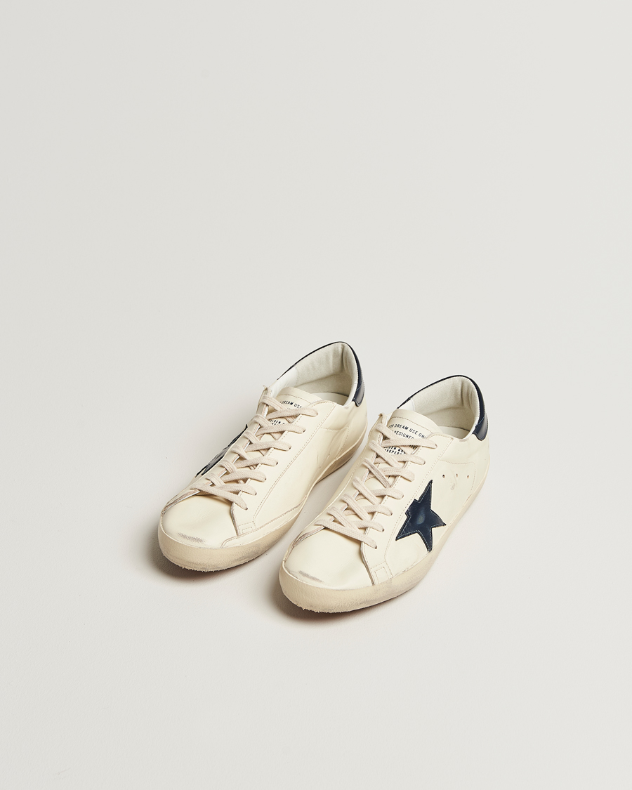 Golden Goose Super-Star Sneakers White/Navy at CareOfCarl.com Golden Goose Super-Star Sneakers White/Navy at CareOfCarl.com