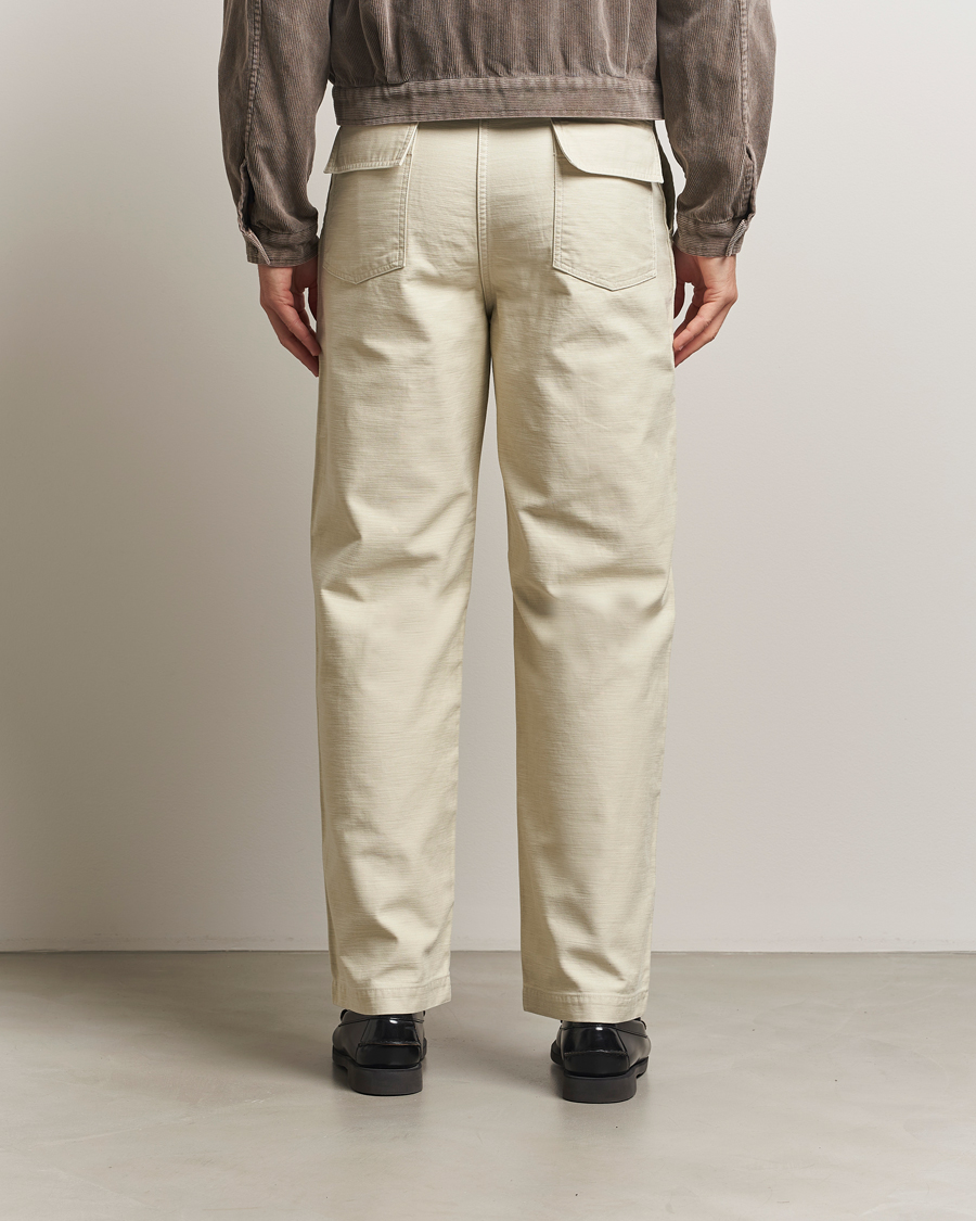 Auralee Bleached Satin Baker Pants Ivory at CareOfCarl.com