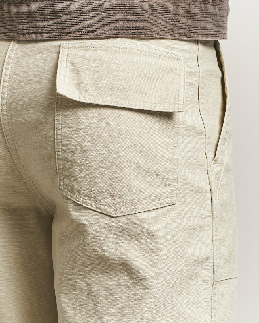 Auralee Bleached Satin Baker Pants Ivory at CareOfCarl.com