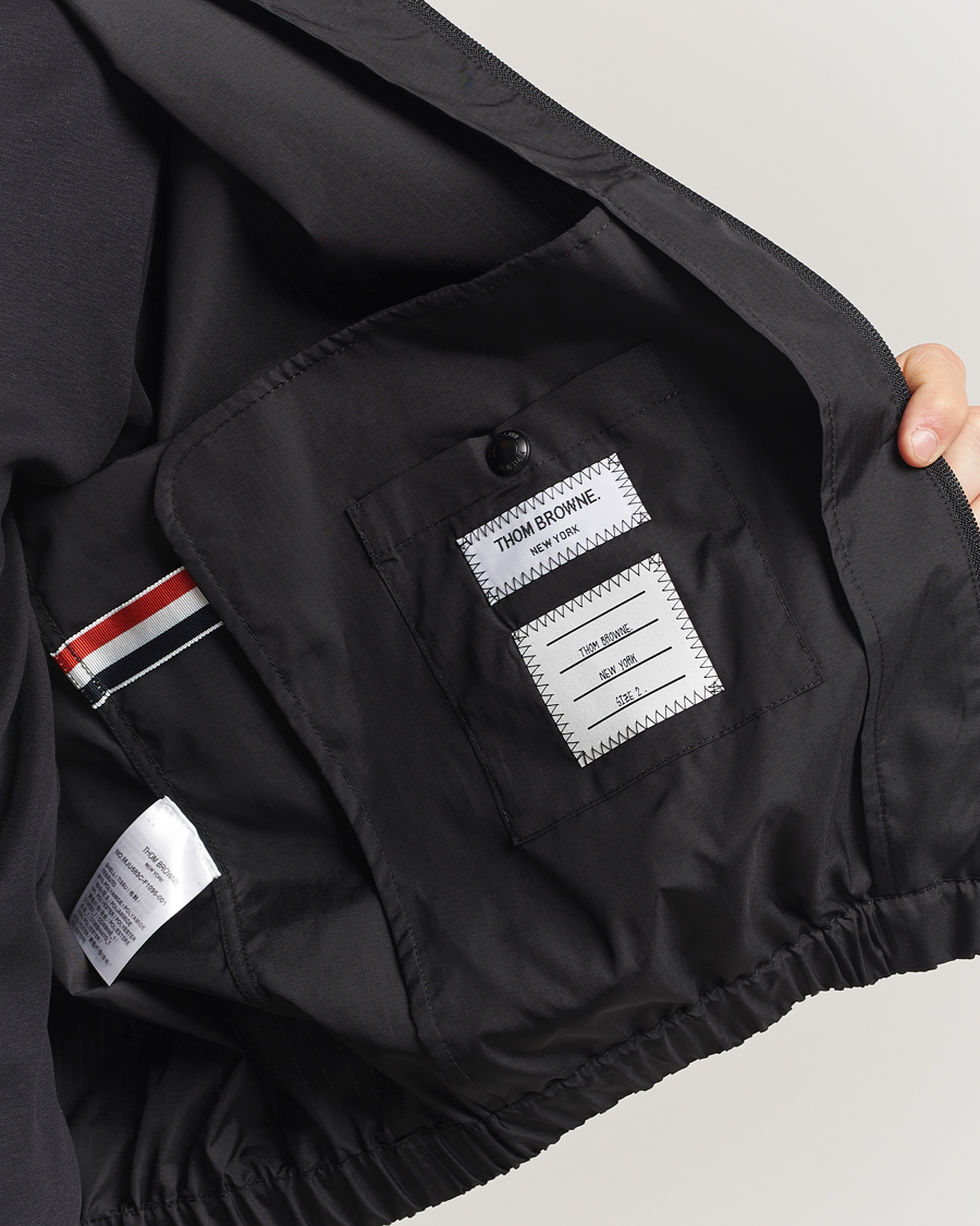 Thom Browne Raglan 4 Bar Nylon Jacket Black at CareOfCarl.com