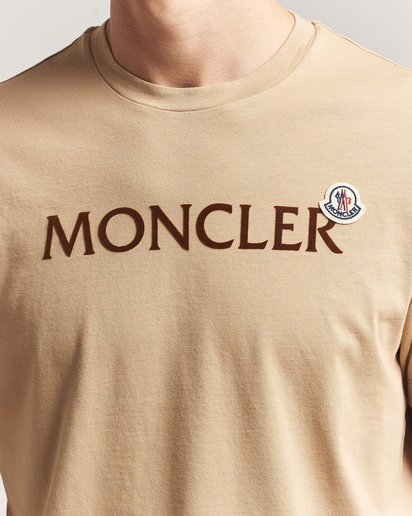 Moncler Lettering Logo T-Shirt Beige at CareOfCarl.com