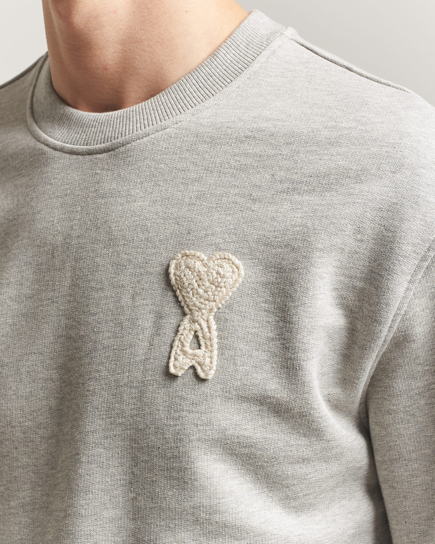 AMI Knitted Heart Logo Sweatshirt Grey Melange at CareOfCarl.com