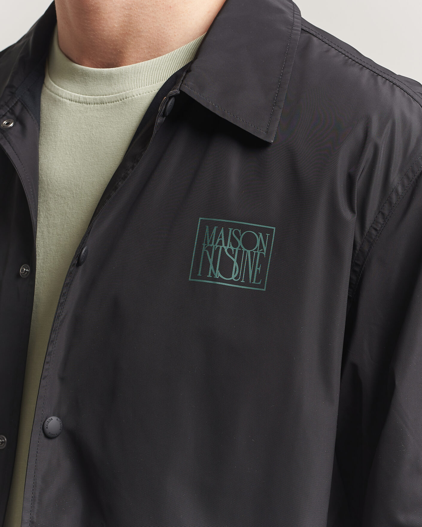 Men | Coats & Jackets | Maison Kitsuné | Tonal Fox Head Coach Jacket Black